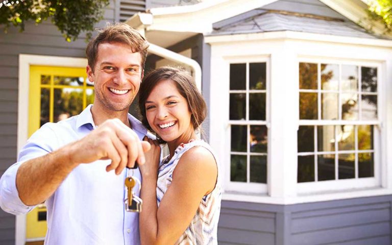 Couple holding house keys